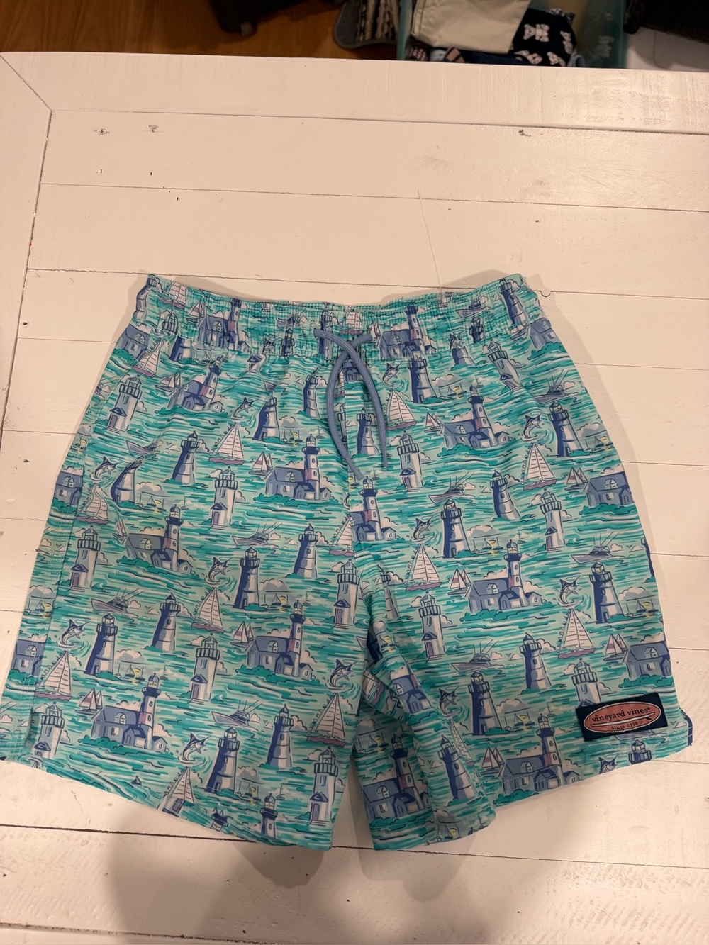 Vineyards Vines Boys gently used Swim Trunks. Lighthouse and Boat Design.
